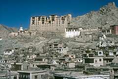 View to the Leh Palace, the former royal palace overlooking Leh. It was constructed circa 1600 by Sengge Namgyal. At left is the Namgyal Stupa (chorten). At right the Gonpa Soma Monastery and the Red Maitreya Temple.