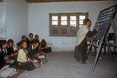 Students and their teacher writing Bodhi (Tibetan) on the blackboard during a lesson in the Girls' High School in Leh.