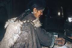 Aunt Nurdzin Dolma making bread at home.