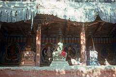 Three chortens under a roof, in Leh.