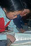 A girl reading in Tibetan.