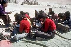 An writing lesson outside, in Lamdon Model School.