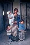 Tsepak Lhamo (6) and her mother and siblings, in front of their home in the Tibetan Refugee Settlement in Choglamsar.