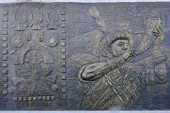 A bas relief in bronze, depicting Naga culture along National Highway 1, the road leading south out of Kohima.