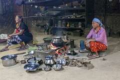 Linkhao and Phamlui, Konyak Naga women in the kitchen area in Tonyei Ahng's house.