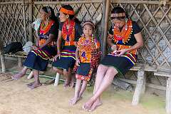 Alih, Ngapcho, and Ngapwang, Konyak Naga women, with a young girl, Ngamlih.