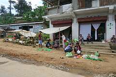 Shops and a street market in Mon town centre.