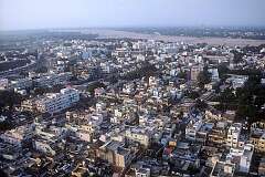 Tiruchirappalli seen from the Rock Fort temple, 83 metres on a rocky outcrop. Clearly visible, on the other side of the Kaveri River, are the gopuram or temple towers of the Sri Rangathaswamy Temple in Srirangam.
