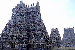 The carved and painted “gopuram” or tower at the southern side of the Sri Rangathaswamy Temple in Srirangam. The temple was first built by the Chola ruler, Dharmavarma. The Kaveri river flood destroyed the temple vimanam, and later, the early Cholas King Killivalavan rebuilt the temple complex that is present today.