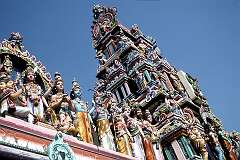 An imposing array of sculptures of Hindu deities on the façade of Shri Kaushika Balasubramanya Swamy Murugan Temple in Puducherry.