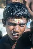 A boy with a Hindu "tikka" on his forehead.