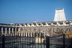 The temple tank or pond at the Ramanathaswamy Temple in Rameswaram. The high “gopuram” or temple tower looms in the background.