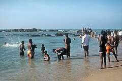 Bathing in the sea off the beach in Kanniyakumari, at Cape Comorin, the southernmost point in India.