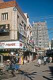 View along the street to a “gopuram” or tower at the Sri Meenakshi Temple, Madurai.