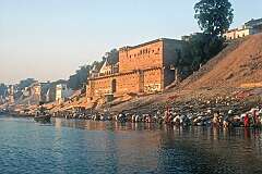 View from a boat to the “ghats” where people are cremated on the banks of the Ganges (Ganga) river in Varanasi.