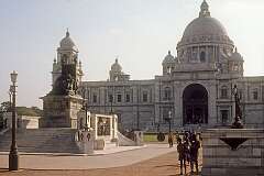 The Victoria Memorial, the domed, white marble museum, opened in 1921, housing displays on the history of Kolkata. A statue of Queen Victoria, then Empress of India, sits in front.