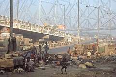 A poor family living on the street near the Howrah Bridge, Kolkata.