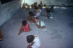 Children making patterns with shells in school, Tuarabu.