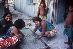 Young women making a concrete kitchen sink in the village of Takarano, in the northeast of Abaiang atoll.