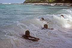 Boys bodysurfing near the airstrip in Tabwiroa, east Abaiang.