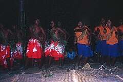 Boys and girl students dancing at a farewell party in Tabwiroa School.