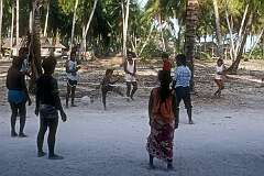 Boys and men playing a ball game in Kariatebike, the largest village on Abemama atoll.
