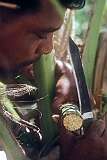 Nikora cutting the spathe to make the “te karewe”, palm toddy, flow, Kabangaki.