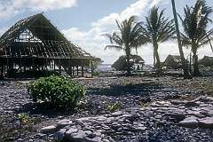 Battered houses along the lagoon in Roreti village, in the south of Arorae island, south Kiribati.