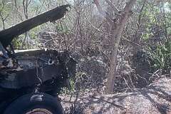 A wrecked truck and mined-out interior in Tabwewa (Tabewa) in the west of Banaba island.