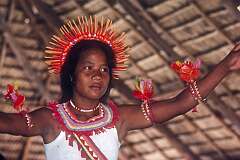 A girl performing traditional Gilbertese dancing in the Maneaba “Te Aake”,  Ukiangang.