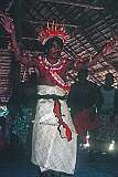 A man, dressed in a mat, performs a traditional Gilbertese dance in the Maneaba “Te Aake”.