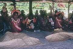 Men performing traditional Gilbertese “sit-down” dancing.