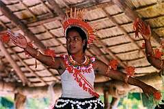 A girl performing traditional dancing in the maneaba “Te Aake” in Ukiangang, Butaritari
