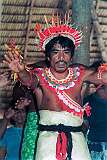 A man, dressed in a mat, dancing in the maneaba “Te Aake” in Ukiangang, Butaritari atoll.