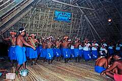 Singing and dancing with costume designs representing Halley's Comet, in the Maneaba “Te Nanoraoi” in Kuma village, in the north of Butaritari atoll.