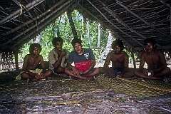 Young men taking a break from collecting copra in the canoe shed at the south point of Onne island, the southernmost point of Makin atoll.
