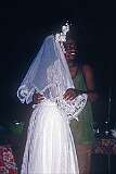 A relative dancing with the bride at the wedding reception in Bairiki.