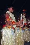 A traditional dance with candles at the wedding reception.
