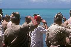 American veterans at Beach Red, saluting their fallen comrades , during the ceremony commemorating the 45th anniversary of the Battle of Tarawa on 20–23 November 1943 in Betio, South Tarawa.