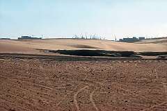 View from the Namib desert to the harbour in Walvis Bay.