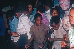 Children dancing in the mission building of Gibeon Roman Catholic Church.