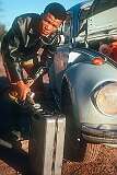 A Nama man filling the jerrycan with petrol in Gibeon (Khaxa-tsûs).