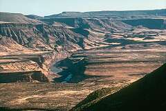 Fish River Canyon, Africa's largest canyon. It features a gigantic ravine, in total about 160 kilometres long, up to 27 kilometres wide and in places almost 550 metres deep.