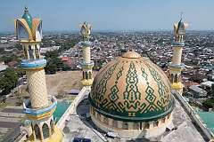 Mataram, Lombok, Indonesia, 2019 - Te Masjid Raya Hubbul Wathan Islamic Centre, its cupola and minarets, looking west towards Ampenan.