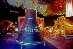 Cape Canaveral, Florida, USA - A Gemini space capsule for two astronauts, with overhead a model of the Soviet Soyuz capsule and in the background an Apollo cabin.
