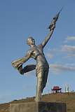 Mandalgov, Mongolia, 2011 - The statue of Yuri Gagarin, the first (Soviet) cosmonaut, in a heroic pose, dressed in a loincloth and holding aloft a space rocket, at Mandaliin Khar Ovoo.