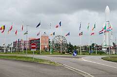 Kourou, French Guiana, 2016 - Entrance to the Centre Spatial Guyanais, with an Ariane rocket and flags of the participating countries in the European Space Agency, near Cayenne.
