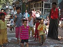 Yangon, Myanmar, 2007 - Games, like this race with a book on their head, to celebrate Independence Day.