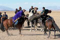 Sagsai, Bayan Ölgii, Mongolia, 2011 - “Kökpar”, a Kazakh tug-of-war on horseback with the headless carcass of a goat, at the Altai Eagle Festival.