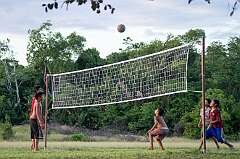 Palumeu, Sipaliwini, Suriname, 2016 - Tiriyó Amerindian boys playing volleyball.
